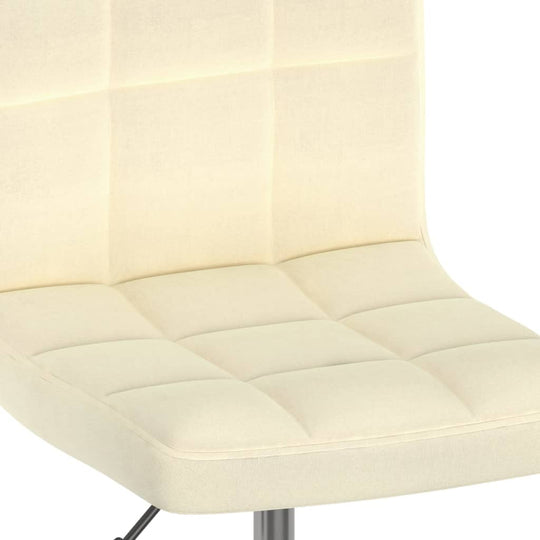 Cream fabric swivel dining chair seat with tufted design and chromed steel frame, ideal for home and outdoor furniture settings.