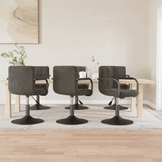 Stylish dark grey velvet swivel dining chairs arranged around a modern table, perfect for home patio or outdoor living space.