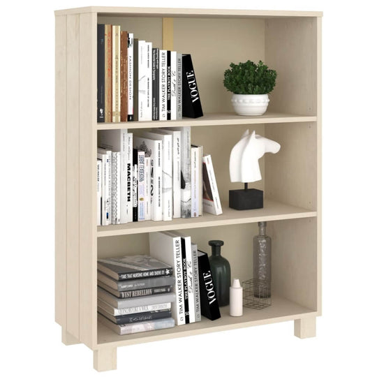 Honey brown book cabinet HAMAR with three shelves, displaying books, decor, and plants, made of solid pinewood.