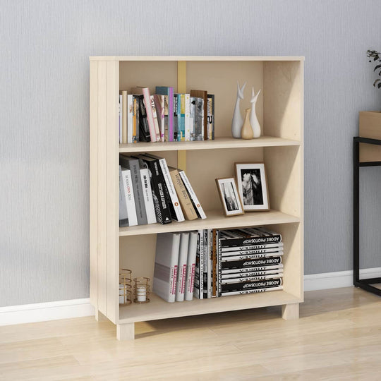 Solid wood book cabinet with three shelves, displaying books and decorative items, enhancing home decor.