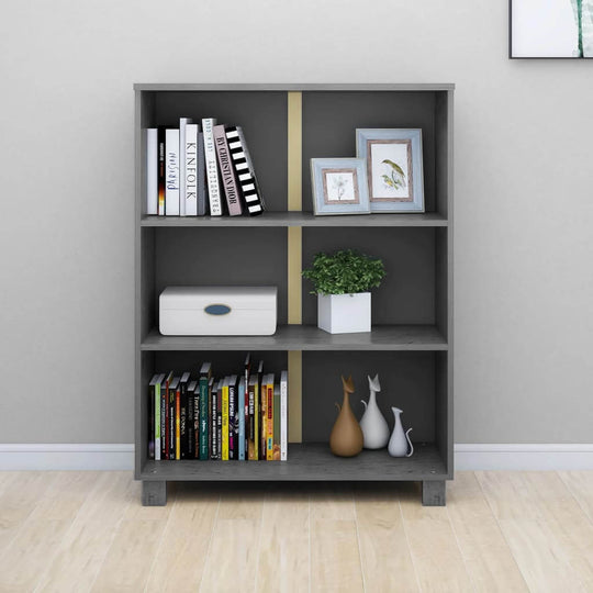 Book cabinet HAMAR in dark grey with three shelves, displaying books, decor, and a potted plant. Solid wood pine design.