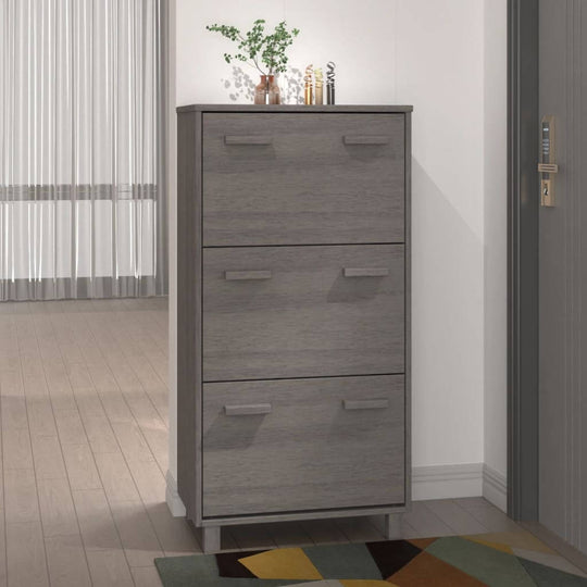 Light grey shoe cabinet with three flip-drawers, ideal for organizing shoes and reducing floor clutter.