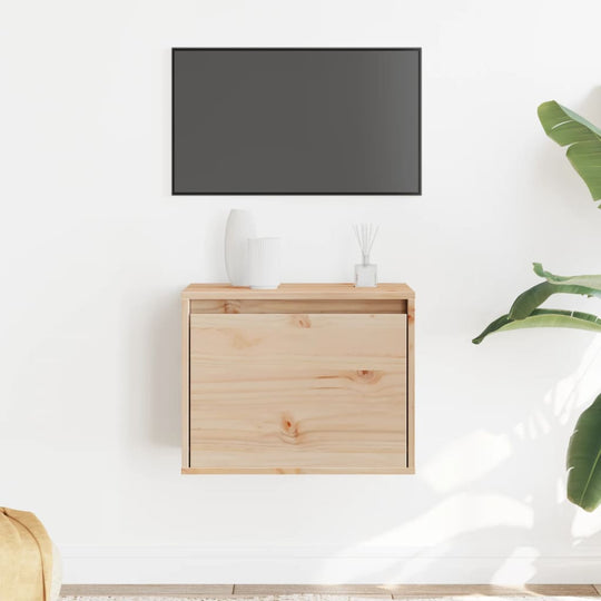 Wall cabinet in solid pinewood with a drawer, enhancing modern decor and functionality in a minimalistic space.