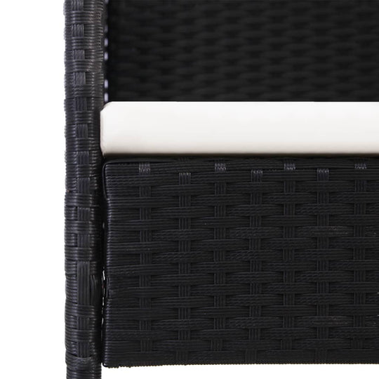 Close-up of black poly rattan garden chair with cream white cushion, showcasing durable outdoor furniture design.