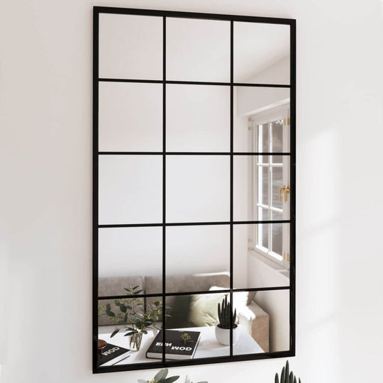 Wall mirror in black metal, 100x60 cm, enhancing indoor space with a stylish grid design and reflecting natural light.