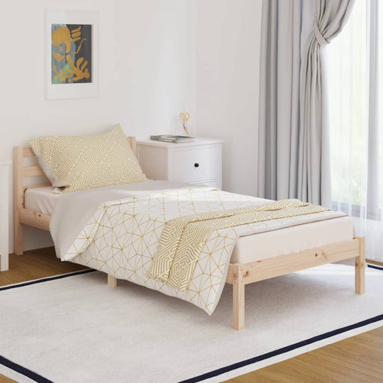 Solid wood pine bed frame without mattress in a modern bedroom setting, featuring elegant bedding and natural light.