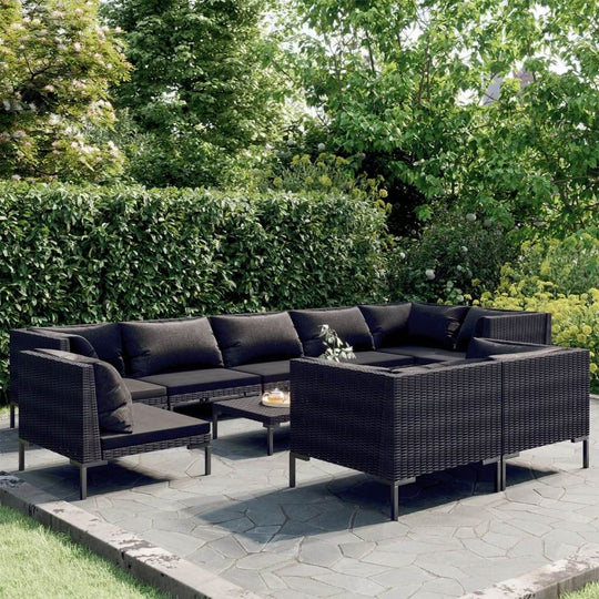 10 piece lounge set featuring a dark poly rattan outdoor sofa with comfortable cushions in a lush garden setting.