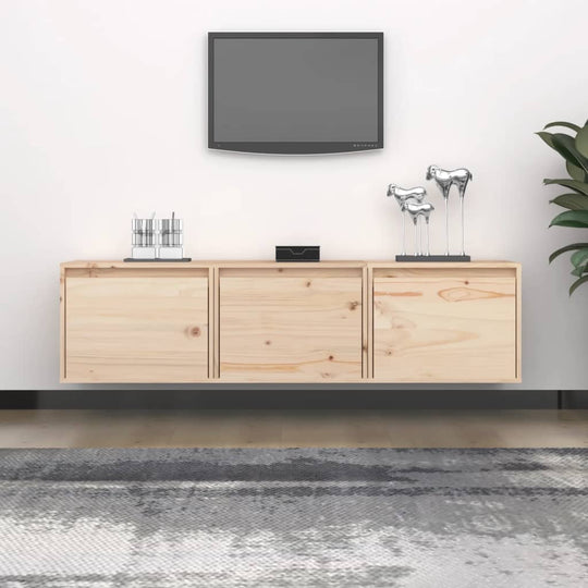 Solid wood pine TV cabinet with three drawers, decor, and a wall-mounted TV in a modern living space.