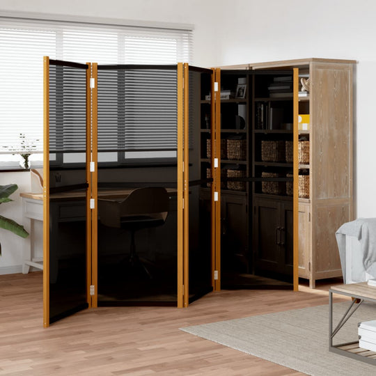 4-panel black room divider made of acacia wood in a modern living space, creating a private area with elegant furniture.