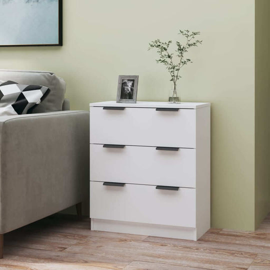 Modern white sideboard with three drawers in a stylish living room setting, enhancing storage and décor.