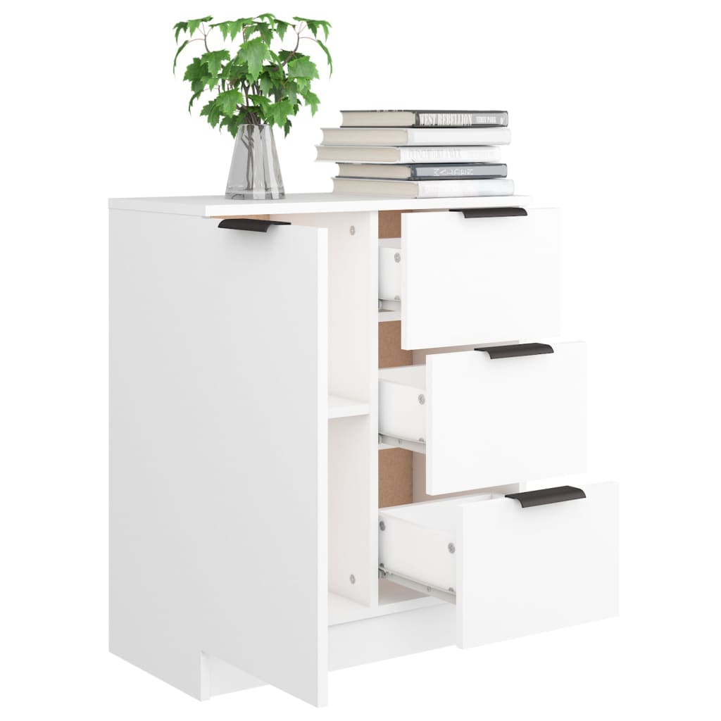 Minimalist white engineered wood sideboard with drawers and shelves, topped with books and a potted plant.