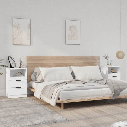 Elegant bedroom setting featuring white engineered wood bedside cabinets and a light wood bed frame with stylish decor.