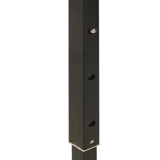 Close-up of the black support pole for the folding party tent, showing adjustable height holes and secure fastenings.