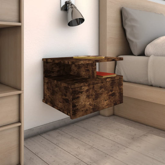 Compact floating nightstand in smoked oak, wall-mounted with storage for books and gadgets, perfect for modern bedroom decor.