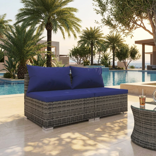 Outdoor rattan garden lounge set with blue cushions in a patio setting, perfect for outdoor living space and home garden furniture.