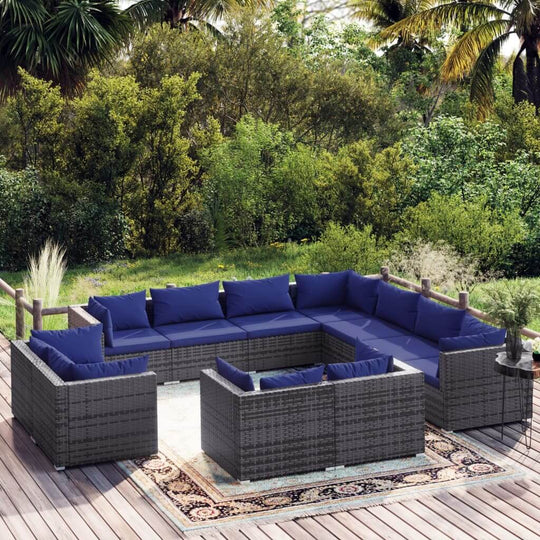 Modern 11-piece garden lounge set with navy cushions, perfect for outdoor seating in a stylish patio or garden.