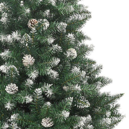 Close-up of an artificial Christmas tree with snow-dusted branches and pine cones, perfect for festive home decor.