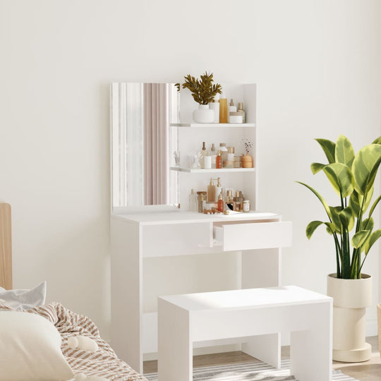 Modern white dressing table with mirror and shelves, ideal for beauty routines in a stylish bedroom setting.