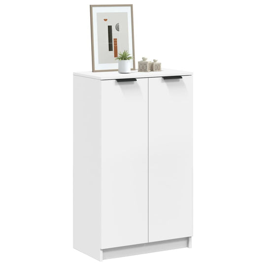 White shoe cabinet 59x35x100 cm in engineered wood with modern decor on top, perfect for organized storage and minimalist style.