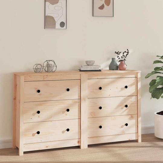 Natural pine wood sideboard with six drawers, decor items, and plants in a stylish living room setting.