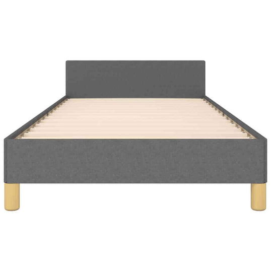 Dark grey fabric bed frame without mattress, 90x200 cm, featuring plywood slats and supportive wooden legs for stability.