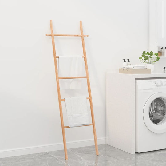 Wooden towel ladder with towels, stylish bathroom storage solution in a modern laundry room setting.