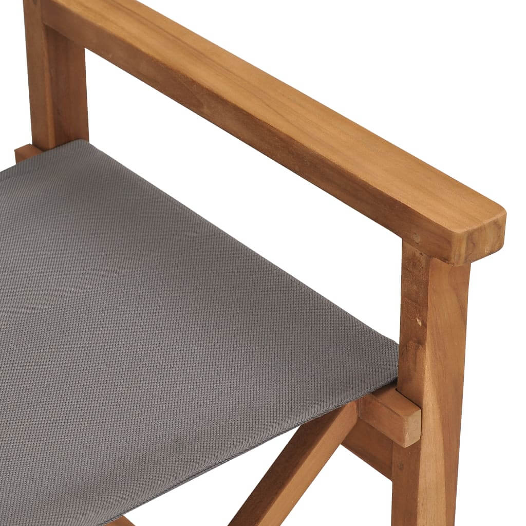 Close-up of a solid teak wood director's chair with a grey fabric seat, ideal for outdoor furniture and lounge settings.