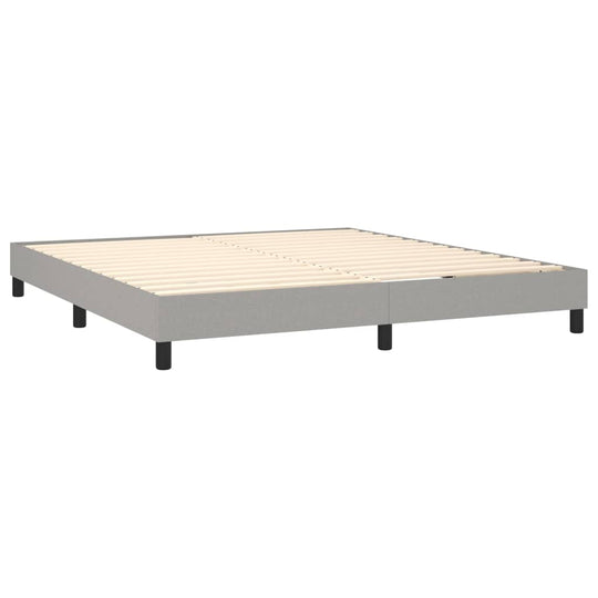 Bed frame without mattress in light grey, 180x200 cm, with plywood slats and sturdy legs for support. Perfect for any bedroom.