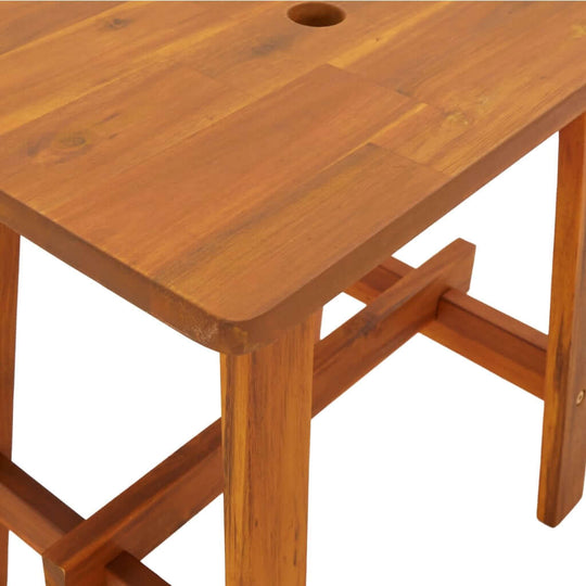 Rectangular solid wood acacia stool with a smooth top and sturdy legs for outdoor or indoor furniture use.