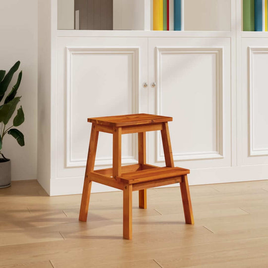 Compact wooden 2 step stool in a modern home setting, perfect for kitchen or outdoor furniture use.