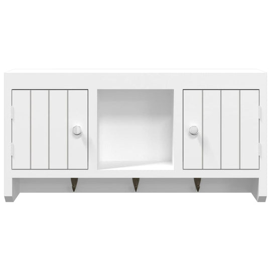 Elegant white cabinet with two doors and hooks, ideal for organizing keys and accessories in a stylish manner.