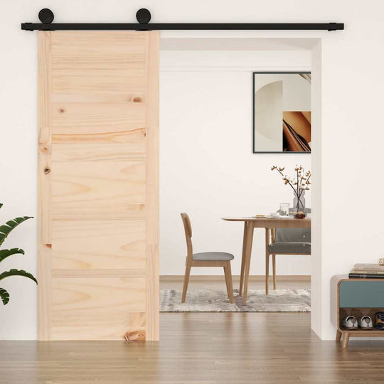 Solid wood barn door in a modern interior, showcasing rustic charm and space-saving design for home decor.