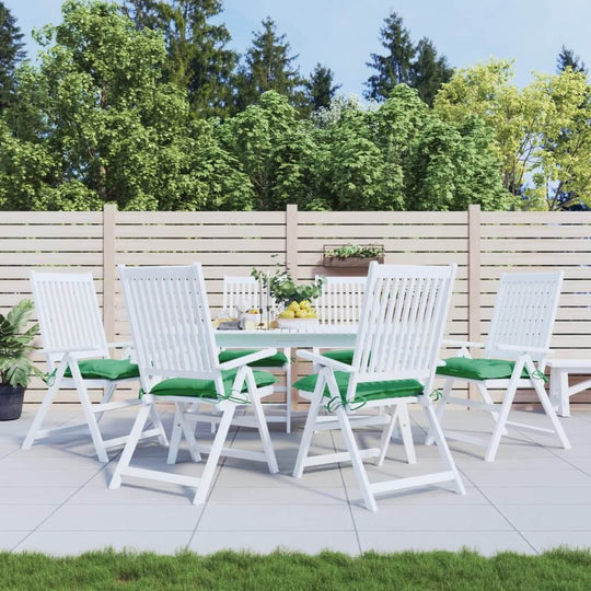 Outdoor dining set with green pallet cushions, perfect for lounge and garden furniture arrangements in a refreshing setting.