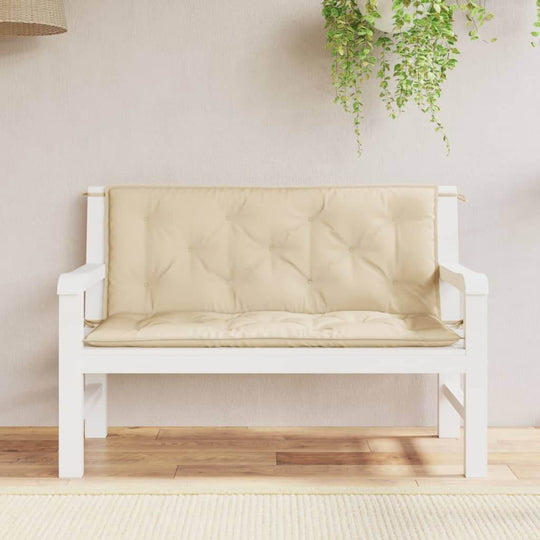 Beige garden bench cushions on a white wooden bench, enhancing outdoor furniture aesthetics. Ideal for lounge and relaxation.