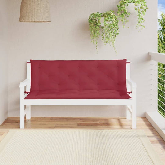 Garden bench with wine red cushion on a white frame, enhancing outdoor lounge space with stylish comfort.