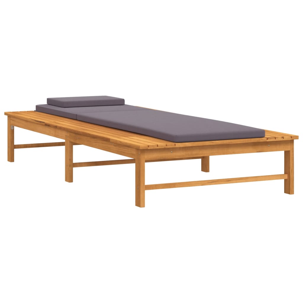 Sun Lounger with Dark Cushion and Pillow Solid Wood Acacia on a patio for comfortable outdoor relaxation.