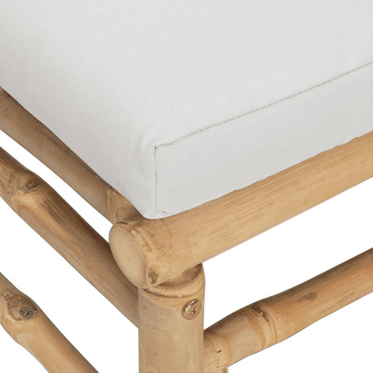 Close-up of light grey cushion on bamboo garden footstool, highlighting comfort and natural material design.