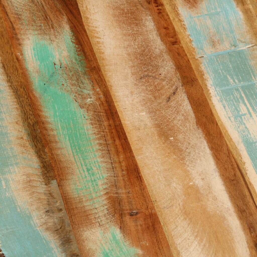 Close-up of reclaimed wood with turquoise accents, showcasing unique textures and colors for rustic furniture design.