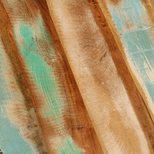 Close-up of reclaimed wood with turquoise accents, showcasing unique textures and colors for rustic furniture design.