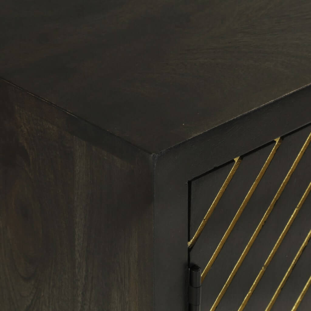 Close-up of black and gold sideboard surface, showcasing solid mango wood texture and elegant design.