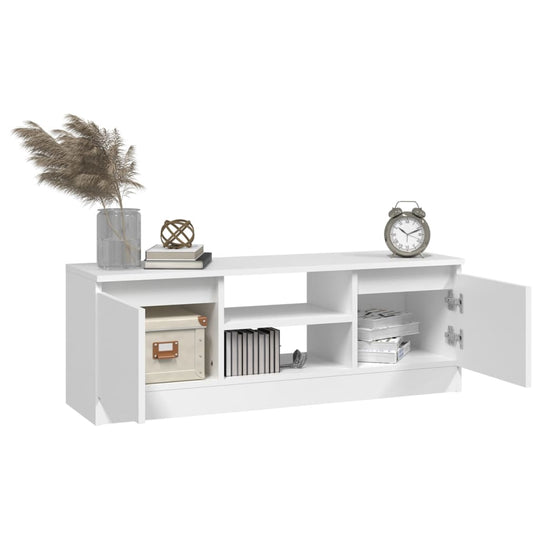 Classic white TV cabinet with doors, shelves, and decor, ideal for stylish living room furniture and storage solutions.