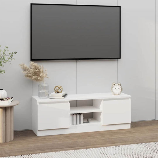 Classic white TV cabinet with door, featuring ample storage for media devices, enhancing modern lounge decor.