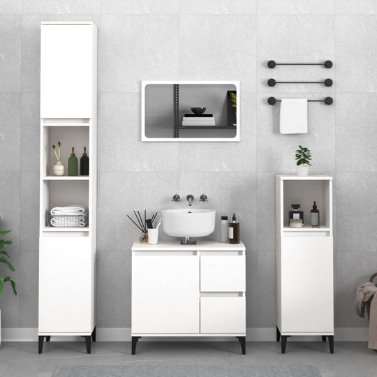 Modern white bathroom furniture set with cabinet, tall storage, mirror, and accessories, organized and stylish.