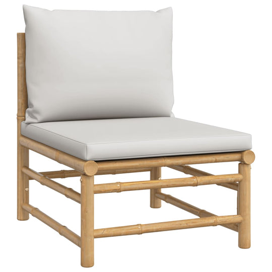 Lounge chair from a bamboo garden sofa set with light grey cushions for outdoor seating.