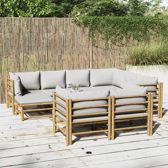 10 piece bamboo garden lounge set with light grey cushions for comfortable outdoor seating in a stylish patio setting.