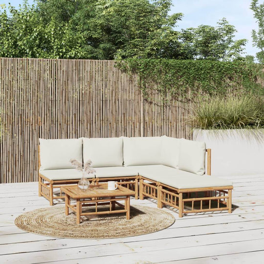 6-piece bamboo garden lounge set with cream white cushions, featuring a sofa, table, and decorative rug for outdoor relaxation.