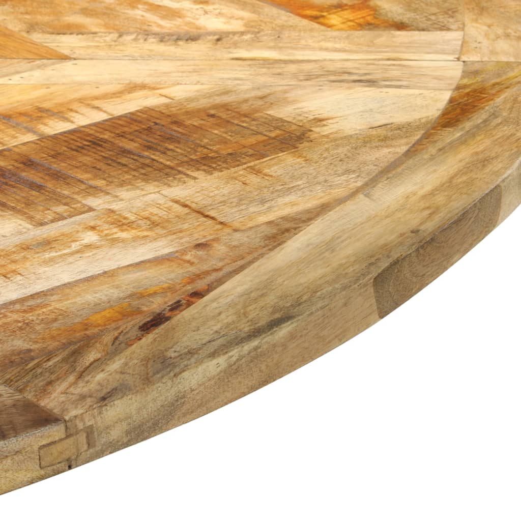 Close-up of a solid mango wood dining table with unique wood grain patterns, showcasing vintage charm and durability.