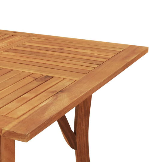 Solid acacia wood dining table surface with slatted design, showcasing natural beauty and durability for outdoor furniture.