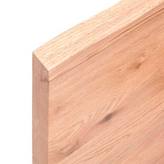 Close-up of light brown solid oak wood edge showcasing natural grain and texture for wall shelf.