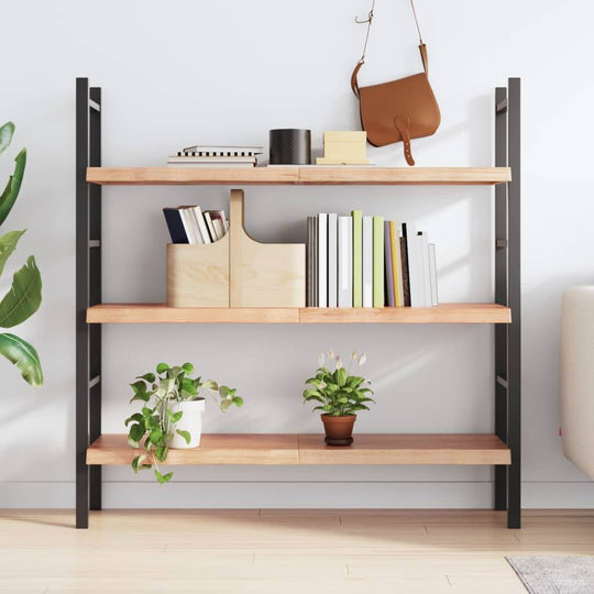 Modern black metal and wood wall shelf with decorative plants and books in a bright living room setting.